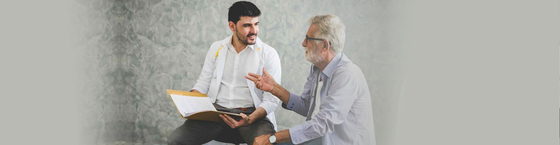 senior man talking to a doctor