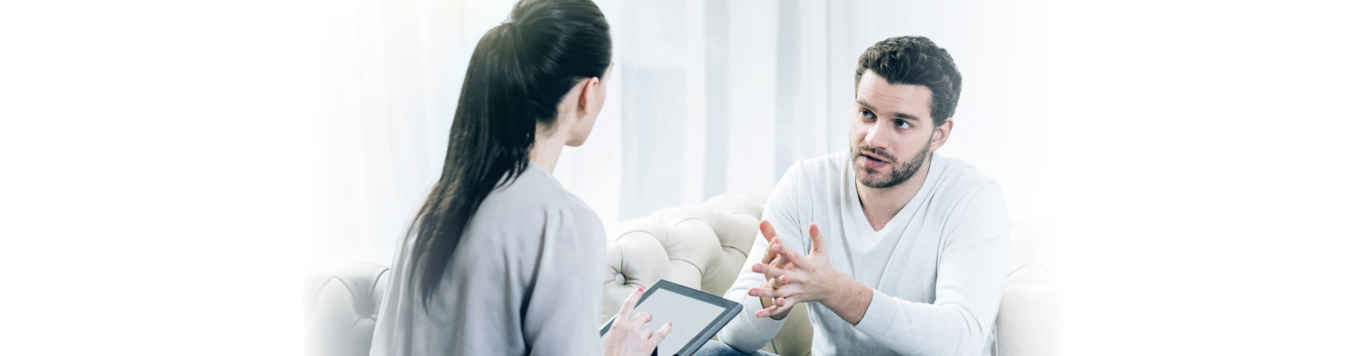 man explaining to a woman