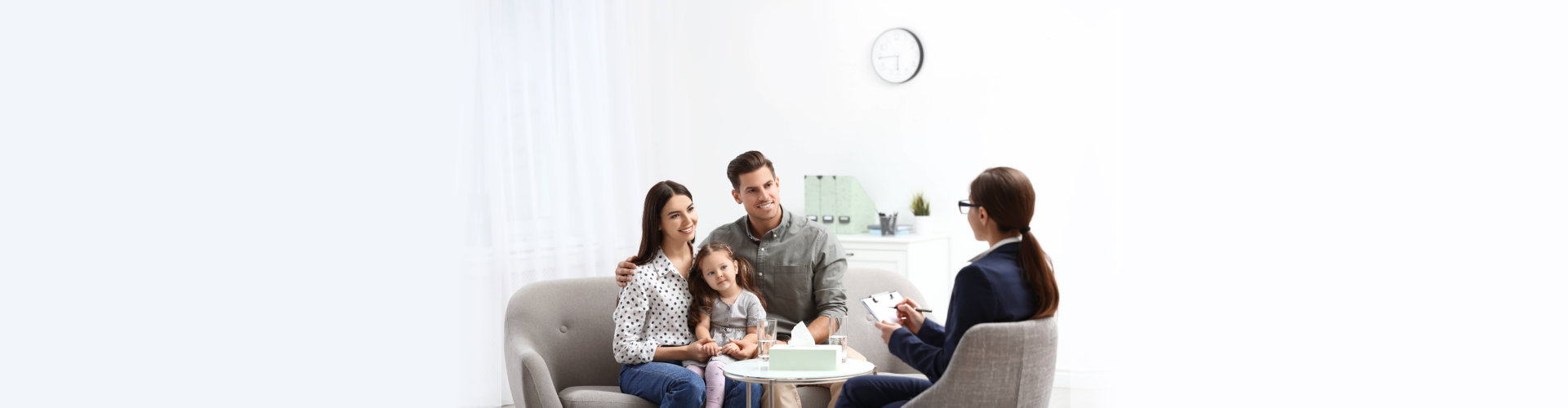 Professional psychologist working with family in office